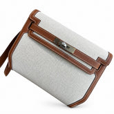 Kelly Depeches 25 clutch, canvas and swift leather (with additional shoulder strap), can be carried cross-body, can be carried by hand or on the wrist, daily needs, seamless switching between business